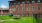 a brick building with a picnic table