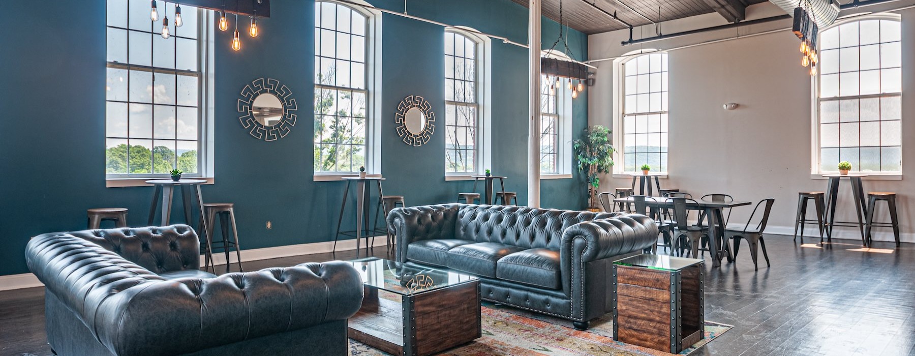 lounge with seating tables and large windows