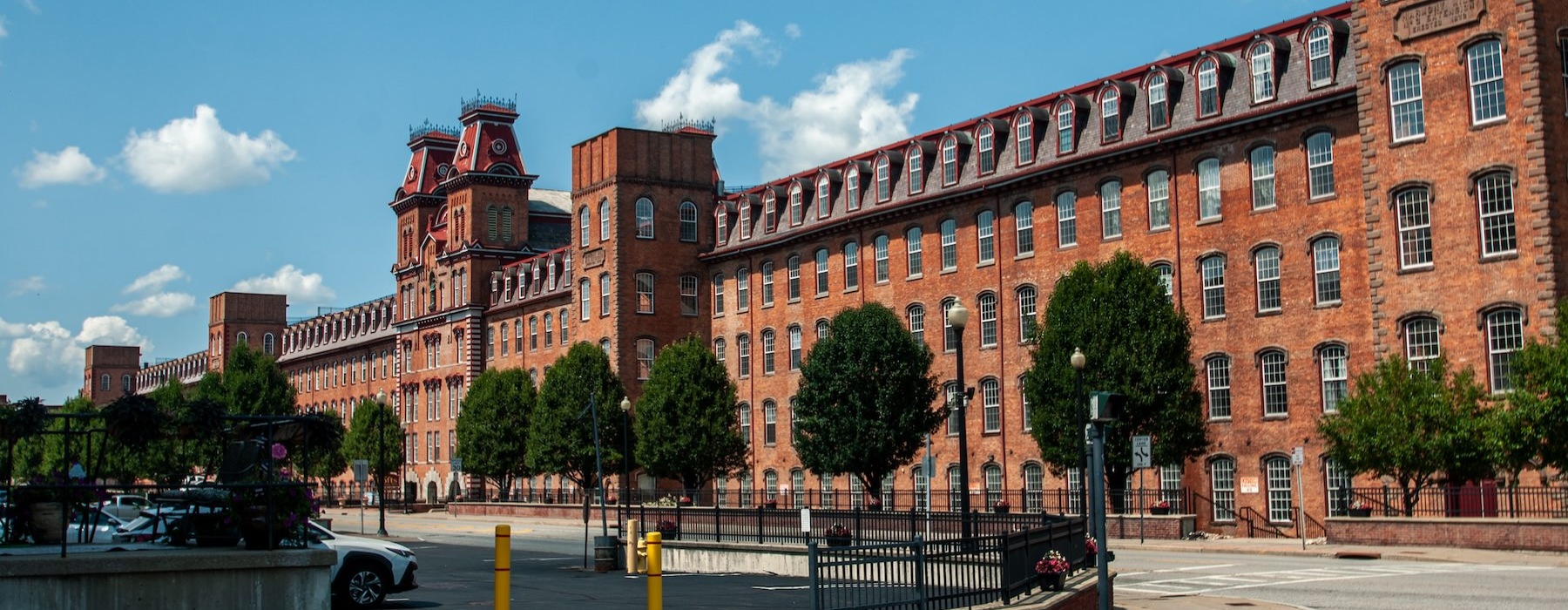 large brick building with a street along it