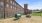 a playground in front of a brick building