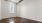 a room with a wood floor and a wood floor with a light