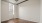 a room with a wood floor and a window