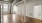 a large empty room with white doors