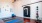 a room with a blue ball and a black door