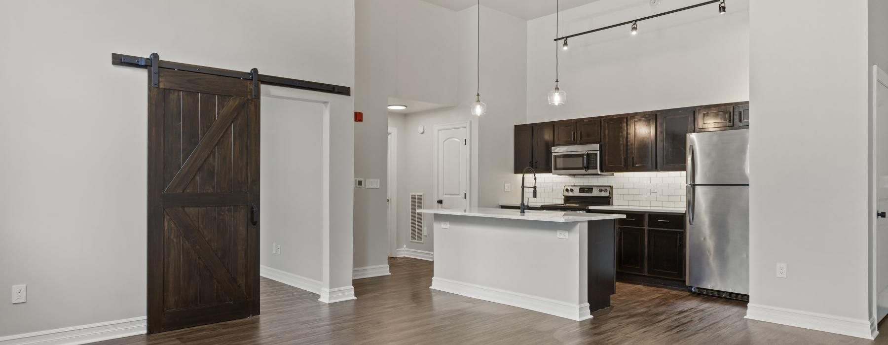 a kitchen with white cabinets