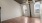 a room with a wood floor and a ceiling fan