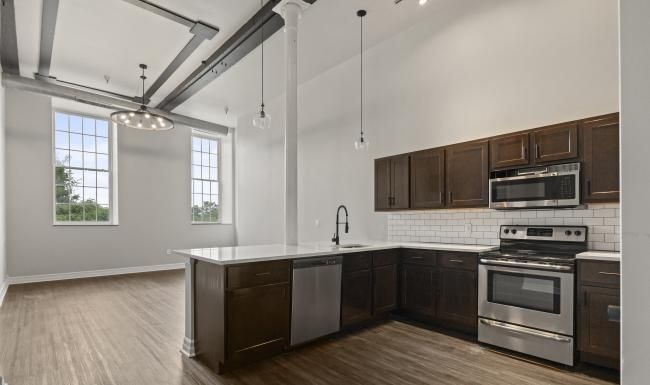 a kitchen with black cabinets