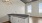 a kitchen with white cabinets